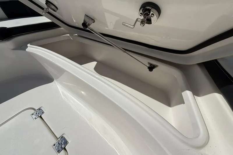 Slide: The Image of Open storage compartment on 2021 Tidewater 2500 Carolina Bay boat. - 10