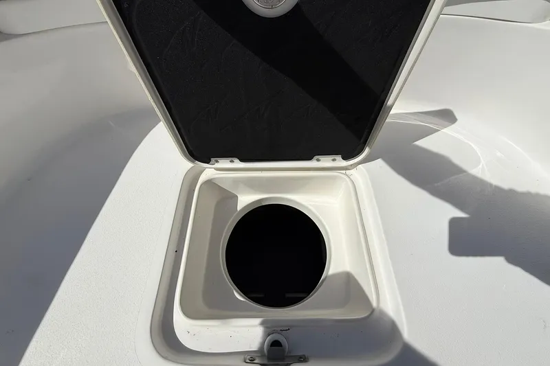 Slide: The Image of Open storage compartment on 2021 Tidewater 2500 Carolina Bay boat deck. - 11