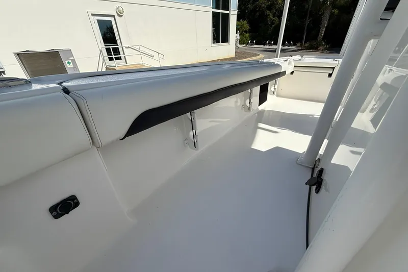 Slide: The Image of 2021 Tidewater 2500 Carolina Bay boat interior, showcasing sleek white seating and modern design. - 15
