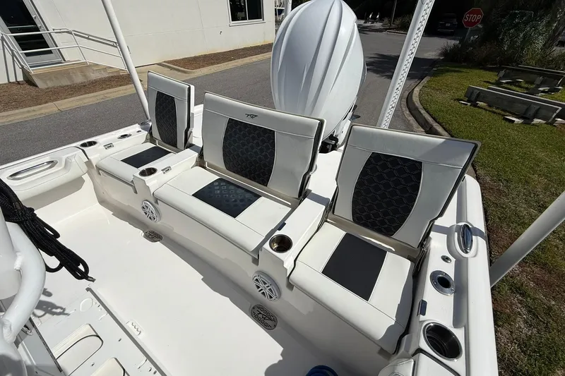 Slide: The Image of 2021 Tidewater 2500 Carolina Bay boat with stylish seating and cup holders. - 21