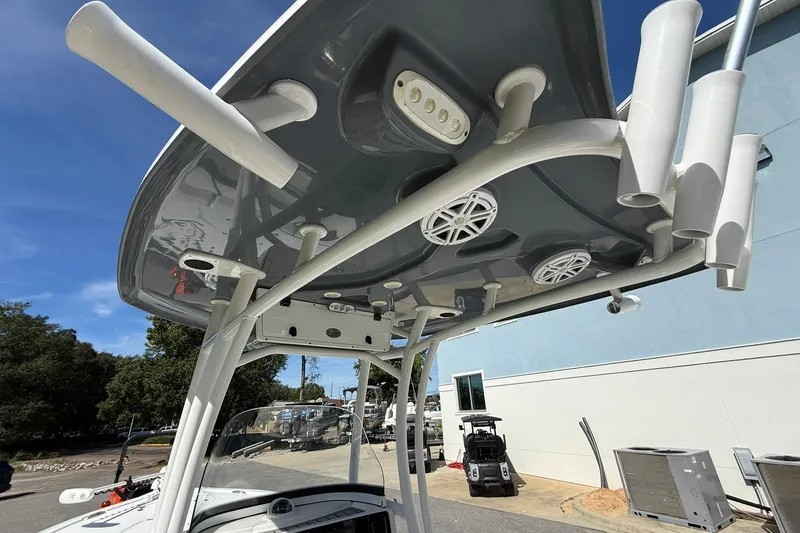Slide: The Image of 2021 Tidewater 2500 Carolina Bay boat with T-top and rod holders. - 23
