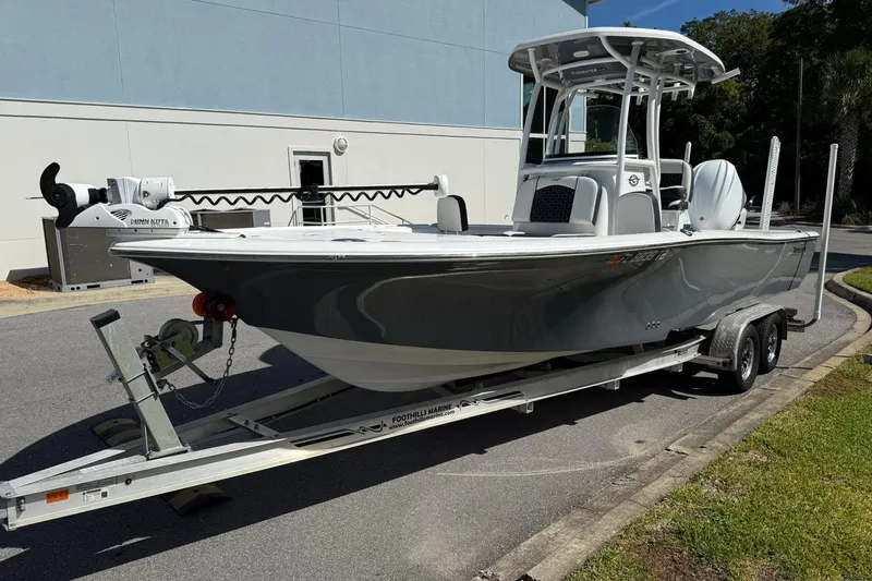 Slide: The Image of 2021 Tidewater 2500 Carolina Bay boat on trailer, parked outdoors. - 5