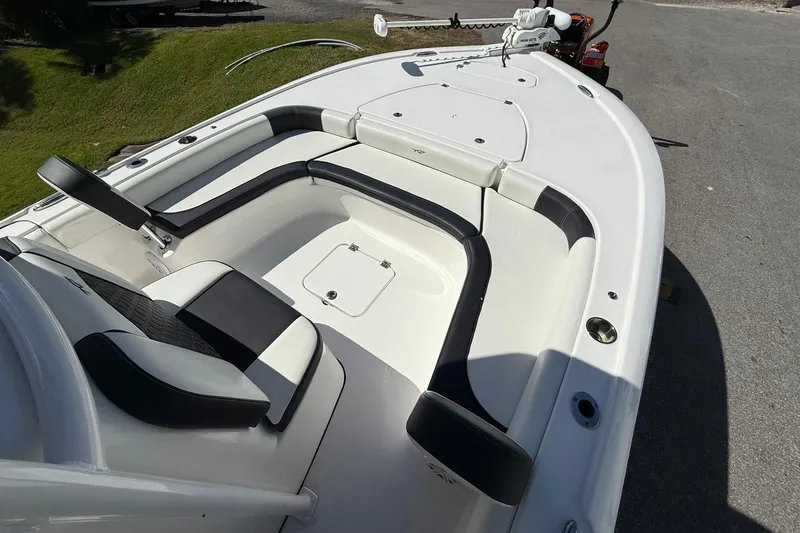 Slide: The Image of 2021 Tidewater 2500 Carolina Bay boat interior with seating and storage compartments. - 6