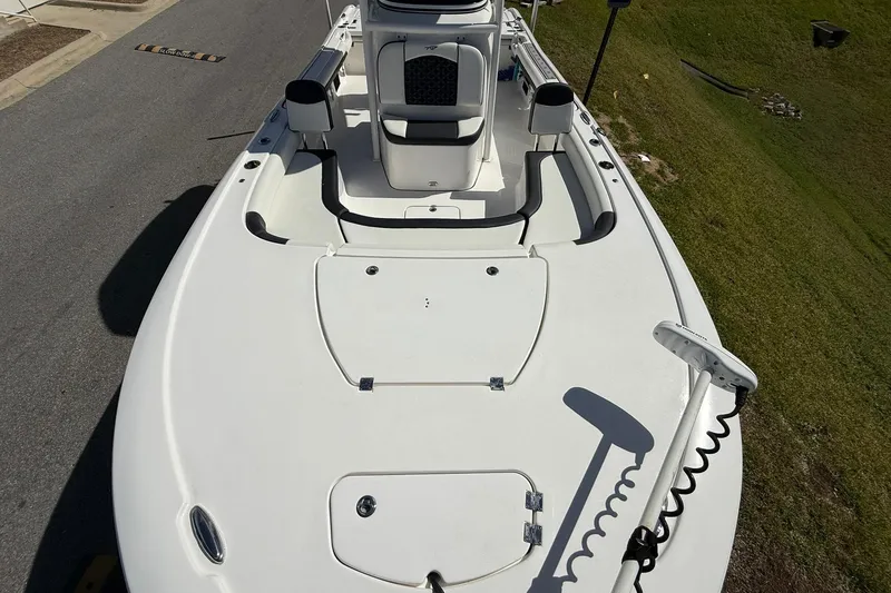 Slide: The Image of 2021 Tidewater 2500 Carolina Bay boat deck with seating and storage compartments. - 7