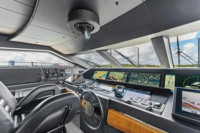 Slide: The Image of Cockpit of 2024 Custom Line 106 yacht with advanced navigation systems and luxurious seating. - 47