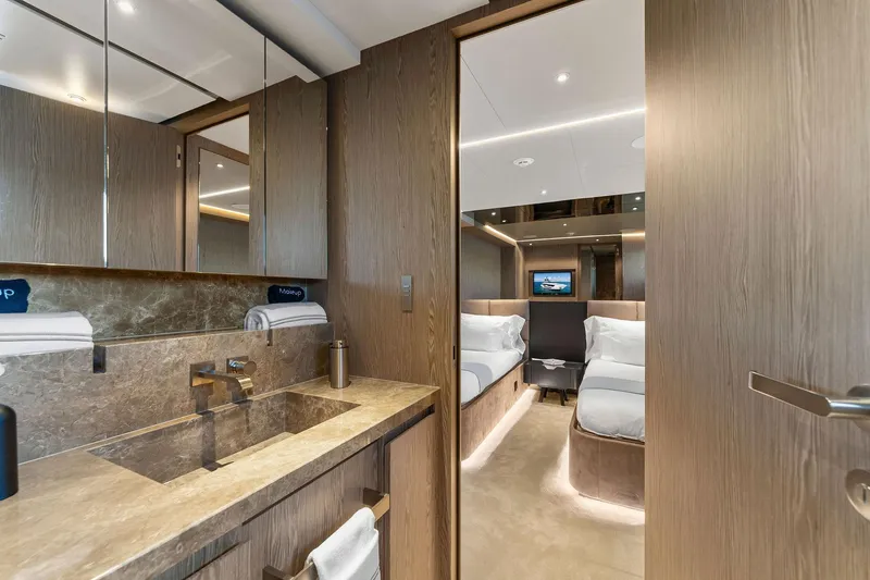 Slide: The Image of Luxurious 2024 Custom Line 106 yacht interior with elegant bathroom and cozy bedroom. - 73