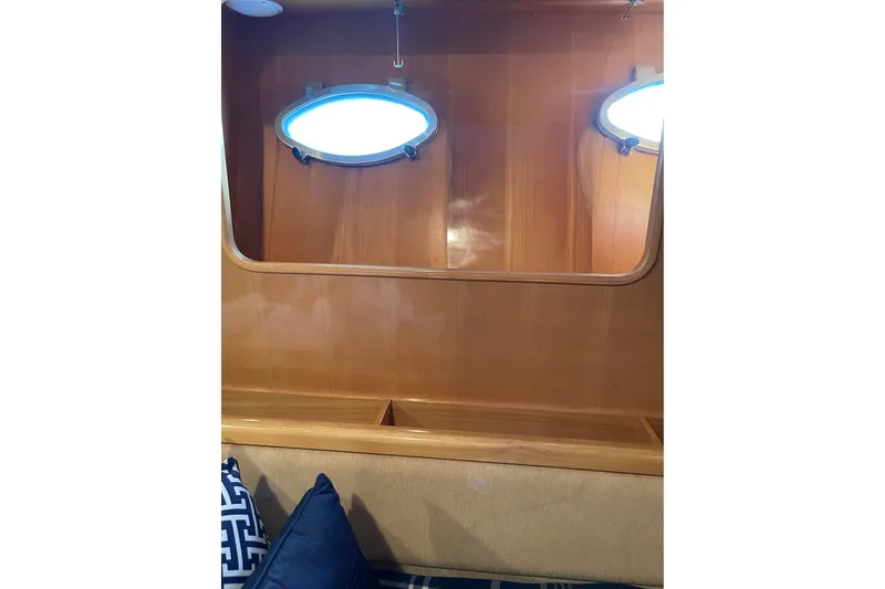 Slide: The Image of Interior view of 1995 JOHNSON 65 Flybridge Motoryacht cabin with twin beds and wooden flooring. - 100