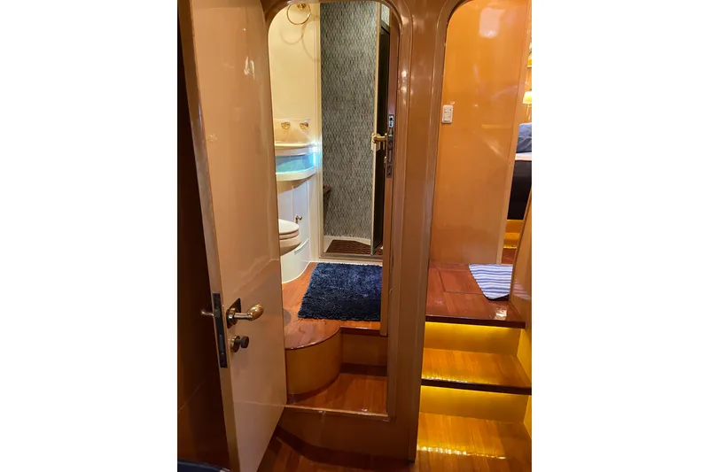 Slide: The Image of Cozy cabin interior of 1995 JOHNSON 65 Flybridge Motoryacht with plaid bedding. - 103