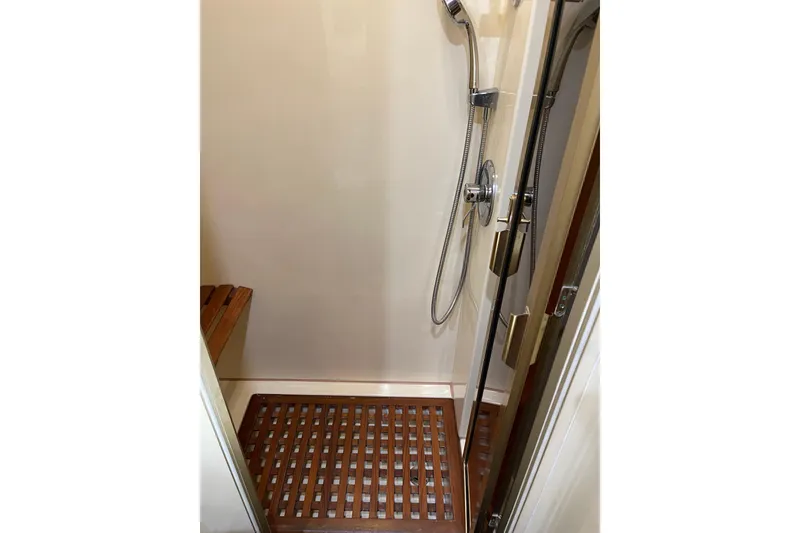 Slide: The Image of Luxurious bedroom interior of 1995 JOHNSON 65 Flybridge Motoryacht with elegant bedding and wood finish. - 109