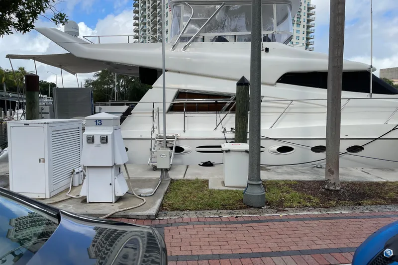 Slide: The Image of Inflatable boat moored beside a 1995 JOHNSON 65 Flybridge Motoryacht. - 11