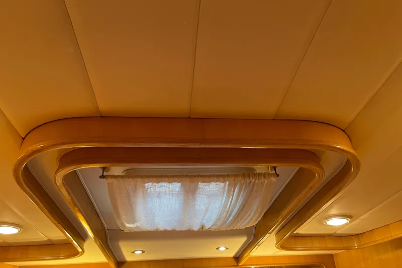 Slide: The Image of Luxurious cabin interior of 1995 JOHNSON 65 Flybridge Motoryacht with TV and mirror. - 112