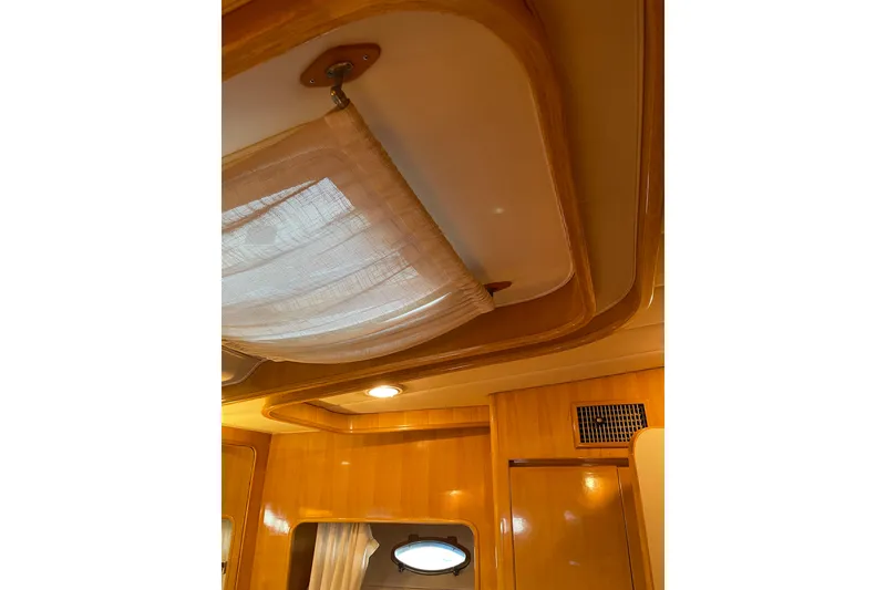 Slide: The Image of Shower area in 1995 JOHNSON 65 Flybridge Motoryacht with wooden floor and chrome fixtures. - 114