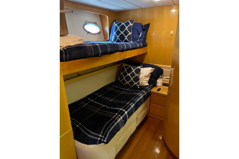 Slide: The Image of Luxurious interior of 1995 JOHNSON 65 Flybridge Motoryacht with wooden cabinetry and seating. - 118