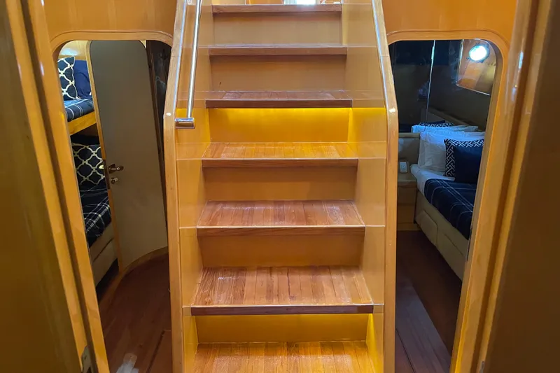 Slide: The Image of Bedside table with remote, phone, and controls on Johnson 65 Flybridge Motoryacht, 1995. - 124