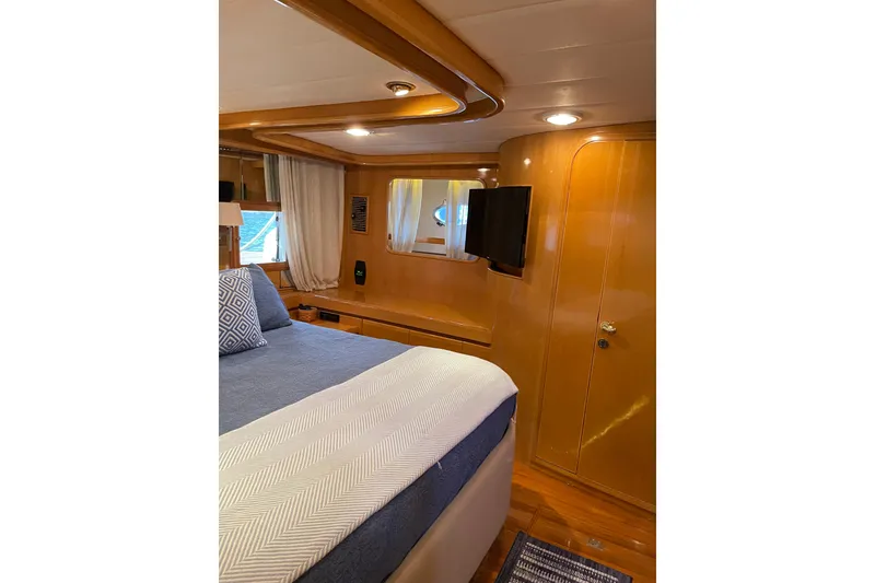 Slide: The Image of Interior of 1995 JOHNSON 65 Flybridge Motoryacht with wooden stairs and cozy cabins. - 129