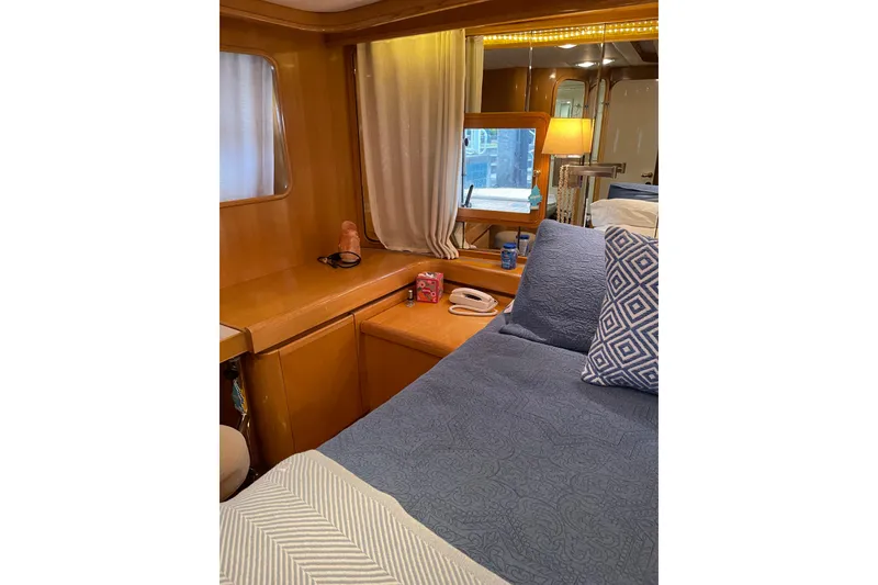 Slide: The Image of Luxurious bedroom interior of 1995 JOHNSON 65 Flybridge Motoryacht with elegant wood finish. - 133