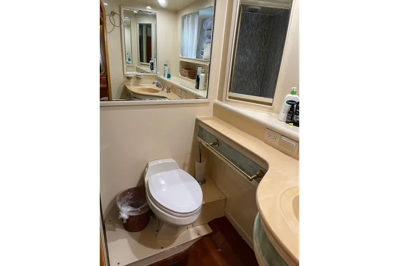 Slide: The Image of Cozy cabin interior of 1995 JOHNSON 65 Flybridge Motoryacht with bed and wooden furnishings. - 138