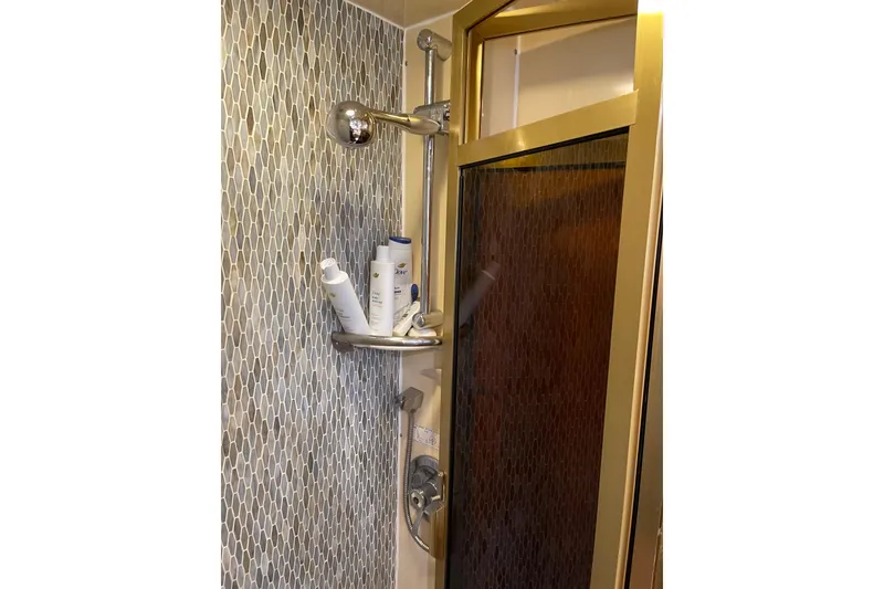 Slide: The Image of Luxurious bedroom interior of 1995 JOHNSON 65 Flybridge Motoryacht with elegant bedding and decor. - 139