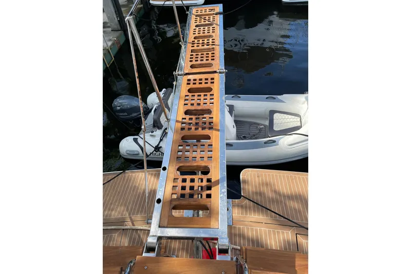 Slide: The Image of Flybridge deck of 1995 JOHNSON 65 Motoryacht with wicker seating and table. - 14