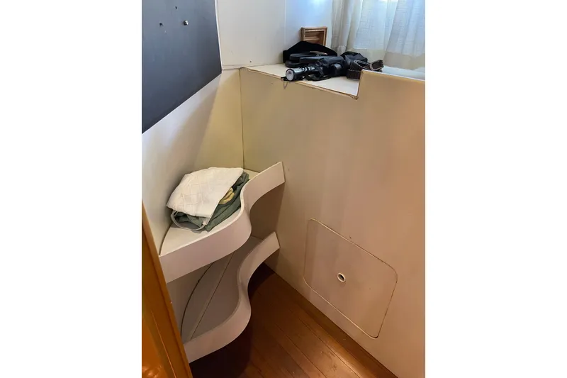 Slide: The Image of Luxurious bedroom interior of 1995 JOHNSON 65 Flybridge Motoryacht with blue bedding and patterned pillows. - 141