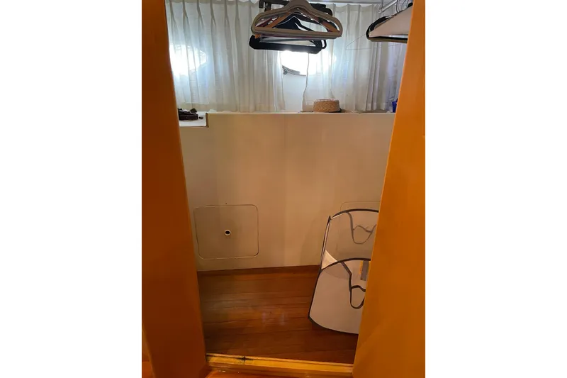 Slide: The Image of Bathroom interior of 1995 JOHNSON 65 Flybridge Motoryacht, featuring toilet and sink. - 143