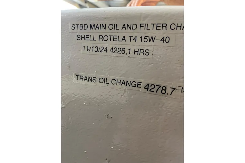 Slide: The Image of Engine room of 1995 JOHNSON 65 Flybridge Motoryacht, showcasing detailed machinery components. - 157