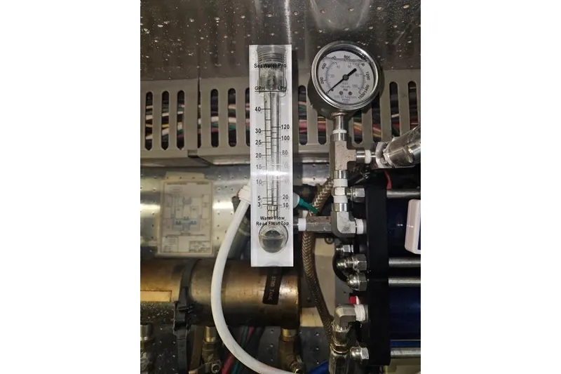 Slide: The Image of Engine room gauge and flow meter on 1995 Johnson Flybridge Motoryacht. - 171