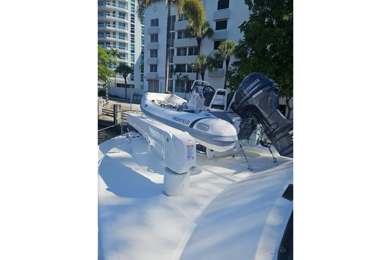 Slide: The Image of 1995 Johnson Flybridge Motoryacht with Highfield tender and Yamaha outboard motor. - 172