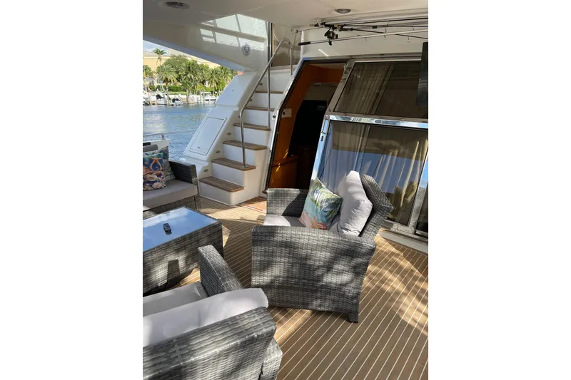 Slide: The Image of 1995 Johnson Flybridge Motoryacht docked with boarding ramp and cityscape background. - 20