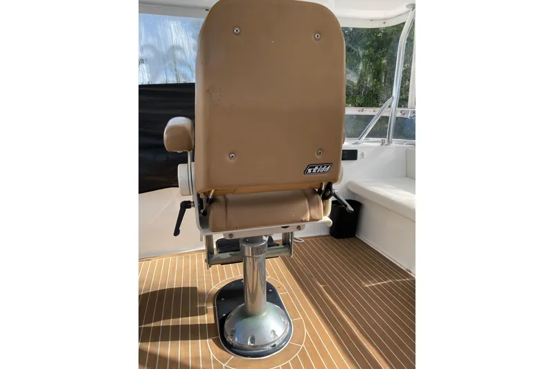 Slide: The Image of Luxurious seating area on 1995 JOHNSON 65 Flybridge Motoryacht with wooden flooring. - 31