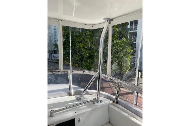 Slide: The Image of Control panel of a 1995 JOHNSON 65 Flybridge Motoryacht with air draft indicators. - 44