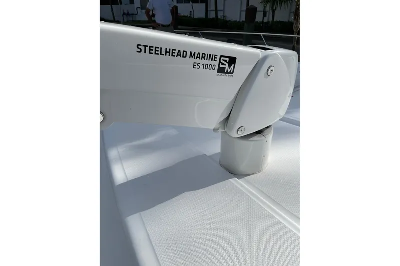 Slide: The Image of 1995 JOHNSON 65 Flybridge Motoryacht view from deck, overlooking marina and waterfront buildings. - 46