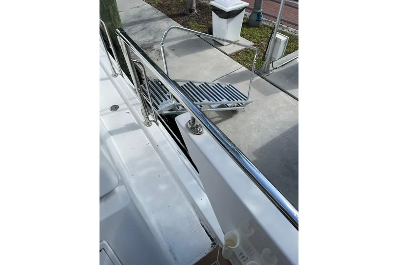 Slide: The Image of 1995 JOHNSON 65 Flybridge Motoryacht on water, showcasing sleek design and spacious deck. - 54