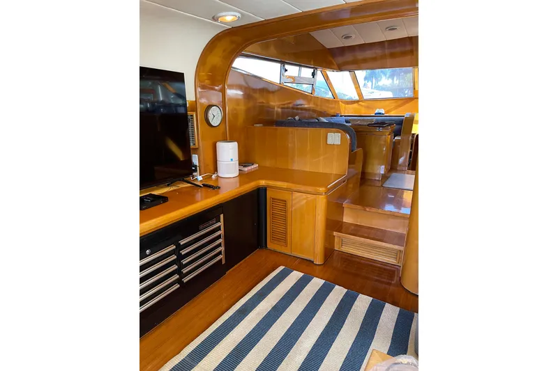 Slide: The Image of Luxurious interior of 1995 JOHNSON 65 Flybridge Motoryacht with cozy seating and decorative pillows. - 60