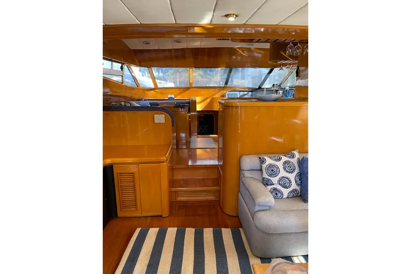 Slide: The Image of Luxurious interior of 1995 JOHNSON 65 Flybridge Motoryacht with elegant seating and decor. - 61