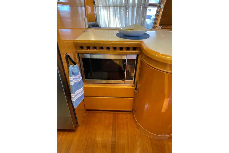 Slide: The Image of Luxurious kitchen interior of 1995 JOHNSON 65 Flybridge Motoryacht with modern amenities. - 72