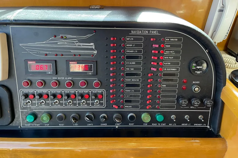 Slide: The Image of Control panel of 1995 JOHNSON 65 Flybridge Motoryacht with steering wheel and navigation instruments. - 83