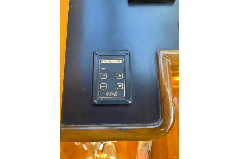 Slide: The Image of Control panel of a 1995 JOHNSON 65 Flybridge Motoryacht, featuring navigation and communication equipment. - 84