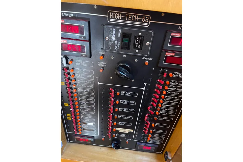 Slide: The Image of Control panel on 1995 JOHNSON 65 Flybridge Motoryacht with engine and generator switches. - 91