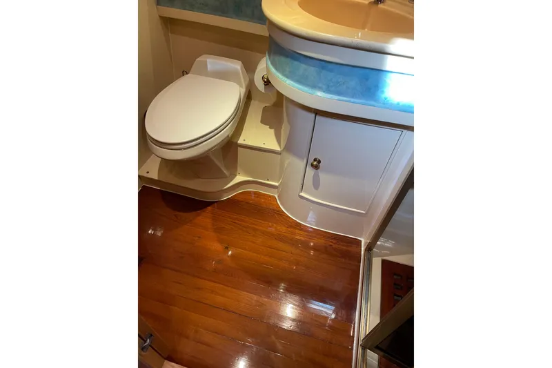 Slide: The Image of Storage compartments on a 1995 JOHNSON 65 Flybridge Motoryacht, showcasing interior design. - 94