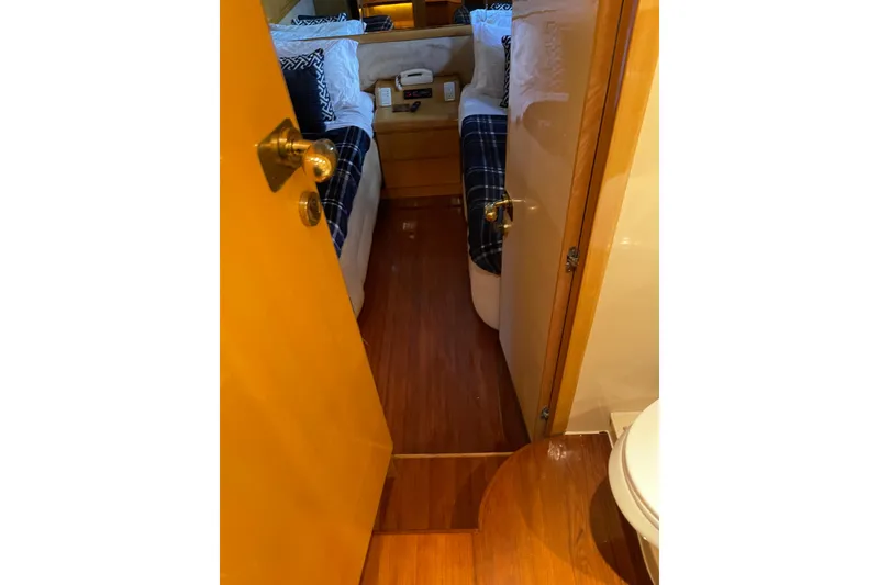 Slide: The Image of Luxurious interior of 1995 JOHNSON 65 Flybridge Motoryacht with cozy seating and decorative pillow. - 95