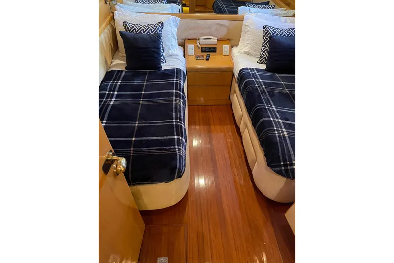 Slide: The Image of Shower area in 1995 JOHNSON 65 Flybridge Motoryacht with wooden floor and textured wall. - 96