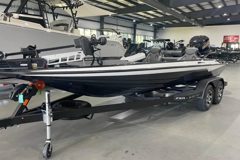 The Image of 2026 Skeeter ZXR20 SE boat on trailer in showroom, featuring sleek design and modern equipment. - 0