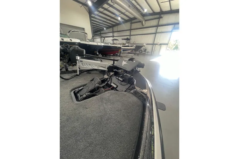 Slide: The Image of 2026 Skeeter ZXR20 SE boat interior in a showroom, showcasing advanced equipment. - 7