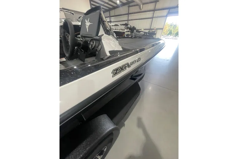 Slide: The Image of 2026 Skeeter ZXR20 SE boat in showroom, showcasing sleek design and modern features. - 8