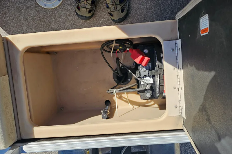 Slide: The Image of 2016 Sun Tracker Fishin' Barge 22 DLX battery compartment with wiring and components. - 22