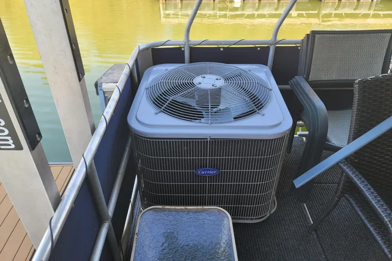 Slide: The Image of Carrier air conditioning unit on 2002 Fantasy 16 X 68 houseboat deck. - 12