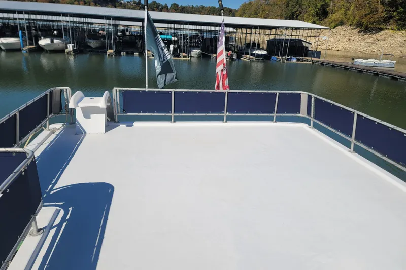 Slide: The Image of Rooftop deck of a 2002 Fantasy 16 X 68 Houseboat at a marina. - 23