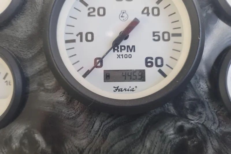 Slide: The Image of Close-up of a Faria RPM gauge on a 2002 Fantasy 16 X 68 Houseboat. - 32