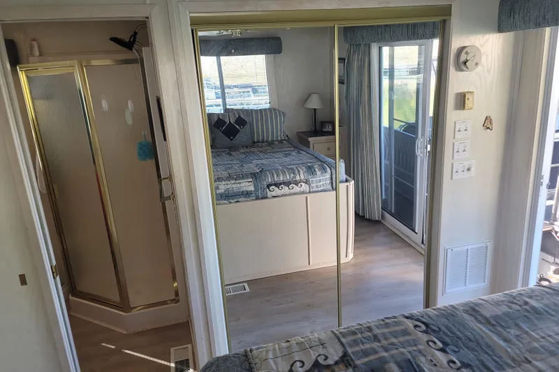 Slide: The Image of Interior of 2002 Fantasy 16 X 68 houseboat with bedroom and shower. - 42